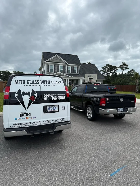 Auto Glass with Class van parked in front of a house, showcasing windshield repair and replacement services.